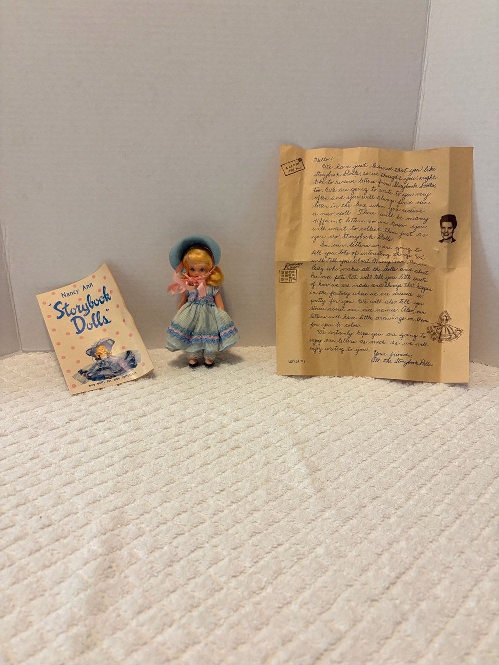 A vintage Nancy Ann Storybook Doll with original booklet and promotional letter.